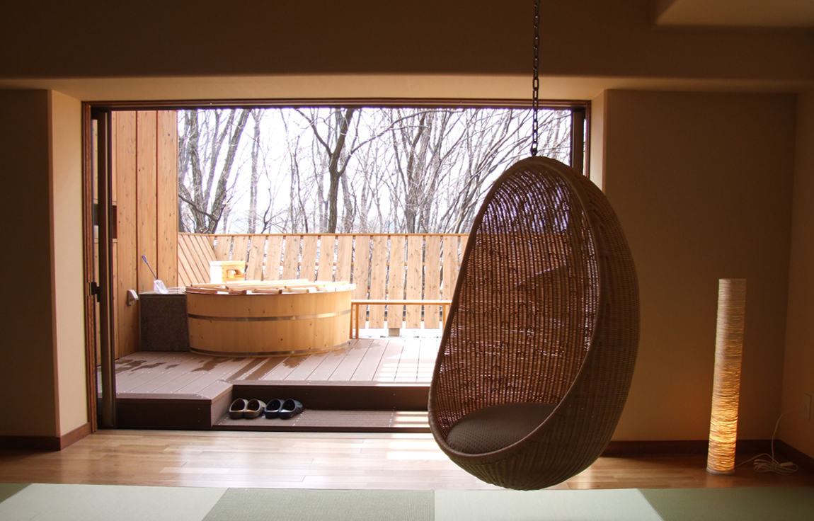 loft-apartment-with-hanging-rattan-chair
