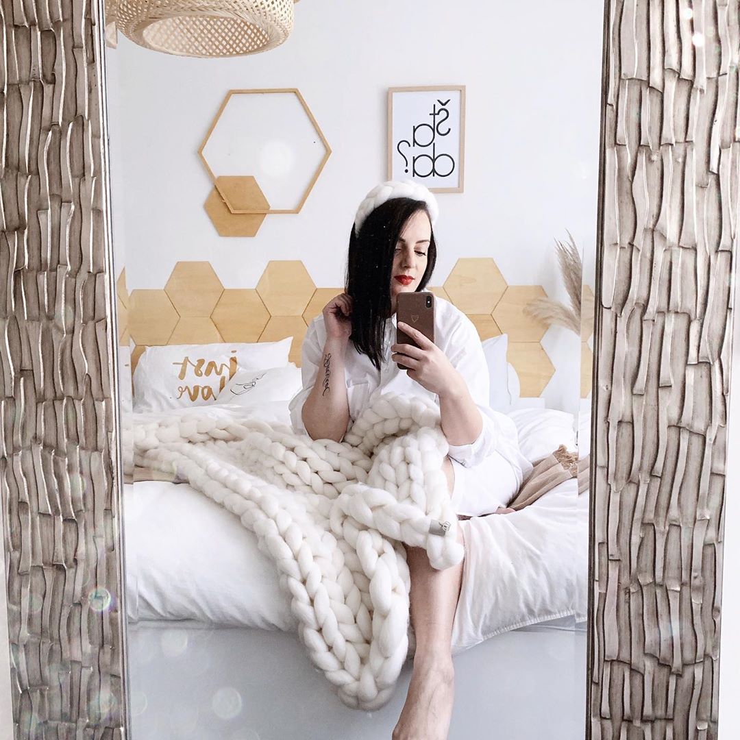 Valentina is sitting on her bed - House Tours
