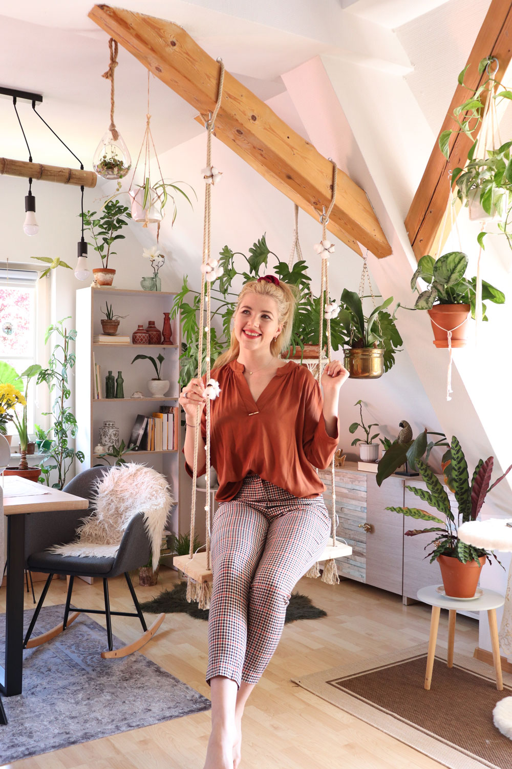 Kristina-Kizilboya-fagusurban-swinging-on-her-DIY-swing-in-her-own-apartment