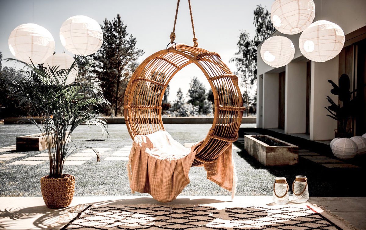 ring-rattan-swing-hanging-from-porch-deck-ceiling-MonnaritaShop