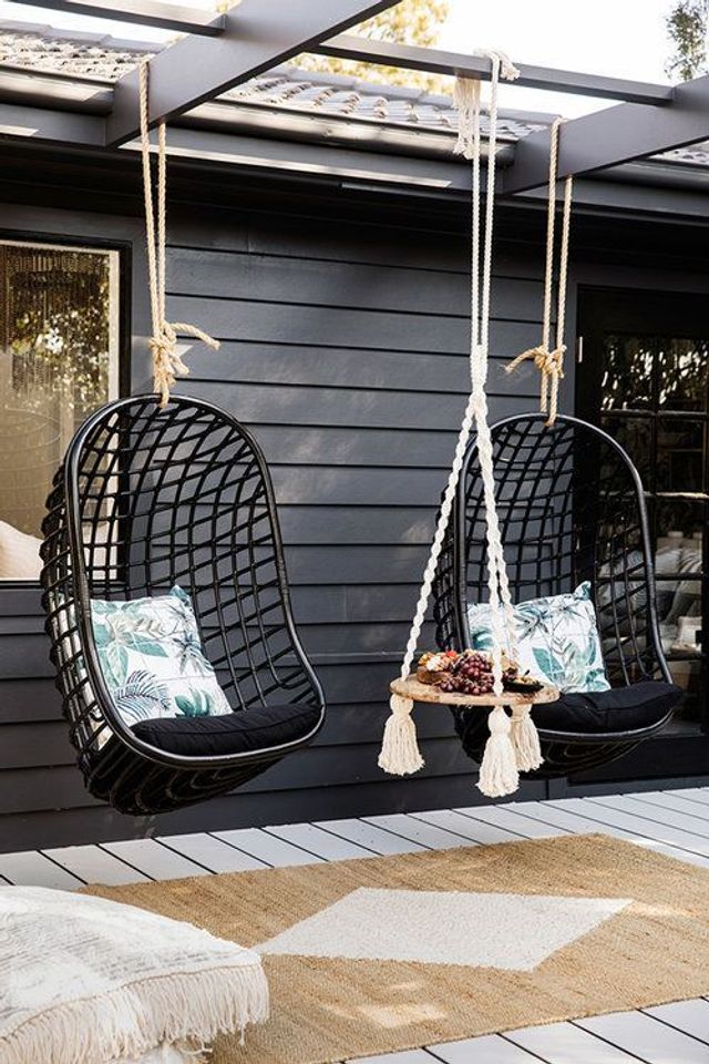 Gothic Outdoor Hanging Chairs with Printed Cushions under pergola